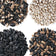 Four different types of seeds arranged in a grid on a white background.