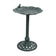 Decorative bird bath with leaf design on a white background