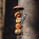 Suet Ball Feeder with a songbird clinging, pecking at fat-and-seed balls. Holds four balls, easy to refill and clean.