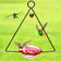 Hummingbird Swing Feeder with red scalloped-edge design, suspended from a triangular metal hanger, features a dangling red glass heart and three hovering hummingbirds.